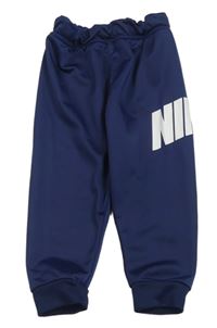 Tmavomodré sportovní tepláky s nápisem Nike