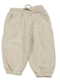 Pudrové tepláky Next