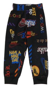 Červené sportovní kalhoty s logy Nike