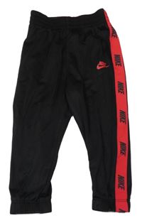 Černé thermo tepláky s logy a červeným pruhem Nike