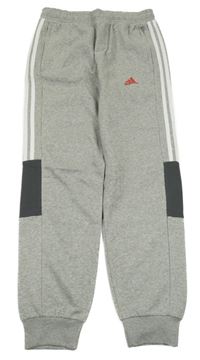 Nové - šedé tepláky s pruhy a logem Adidas