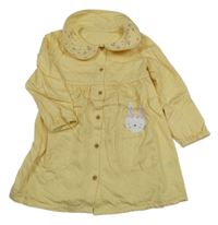 Nové - Žluté plátěné propínací šaty s králíkem a květovaným límečkem Dunnes