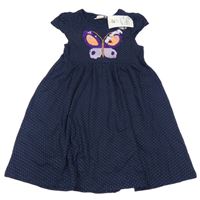 Nové - Tmavomodré puntíkaté bavlněné šaty s motýlem z překlápěcích flitrů Topolino