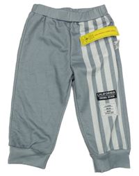 Nové - šedé sportovní tepláky s nášivkami a bílými pruhy SHEIN