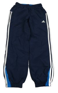 Tmavomodré šusťákové funkční kalhoty s pruhy Adidas 