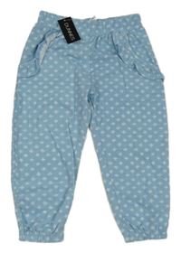 Nové - světlemodro-bílé vzorované teplákové kalhoty s volánky St. Bernard