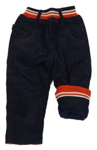 Tmavomodré zatetelené manšestráky s červeným úpletovým pasom