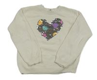 Biely sveter so srdíčkem z překlápěcích flitrů H&M