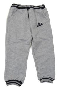 Sivé melírované tepláky s logem Nike