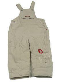 Béžové šušťákové zateplené na traké nohavice s psíkom a nápisom Kanz