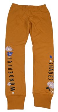 Oranžové tepláky s nápisy a květy PRIMIGI