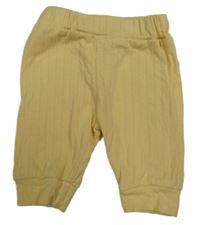 Svetložlté vzorované tepláky