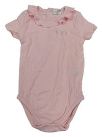 Světlerůžové body s nápisem Orsolino