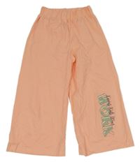 Svetlooranžové široké slabé crop tepláky s nápismi