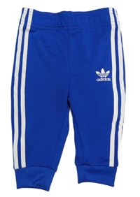 Tmavomodré sportovní tepláky s pruhy Adidas