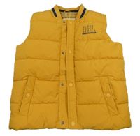 Okrová šusťáková prošívaná zateplená vesta C&A