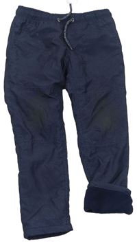 Tmavomodré vzorované šušťákové podšité nohavice C&A