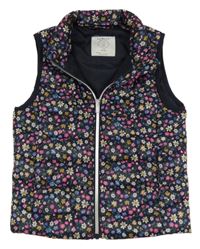 Tmavomodrá kvetovaná šušťáková zateplená vesta Primark