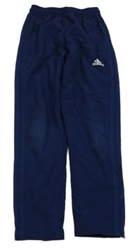 Tmavomodré šušťákové podšité funkčné nohavice s logom Adidas