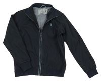 Tmavomodrá šusťáková jarní bunda Next