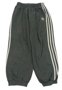 Sivé tepláky s pruhmi a logom Adidas