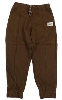 Hnědé tepláky s nášivkou Sinsay