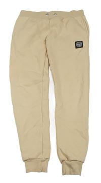 Pudrové teplé tepláky s nášivkou STONE ISLAND