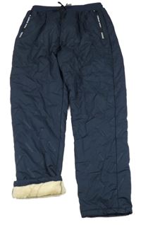 Tmavomodré šusťákové zateplené kalhoty 