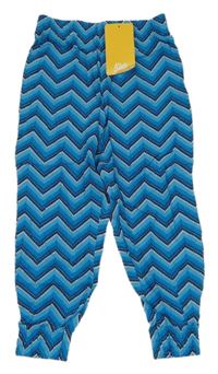 Nové - modro-petrolejovo-tmavomodro-biele vzorované cuff ľahké nohavice Kids