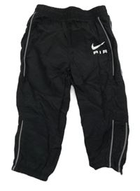 Čierne šušťákové nohavice s logom Nike