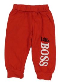 Červené tepláky s nápisom