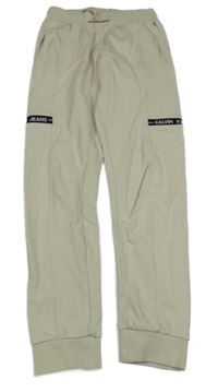 Béžovo-černé tepláky s nápisy Calvin Klein