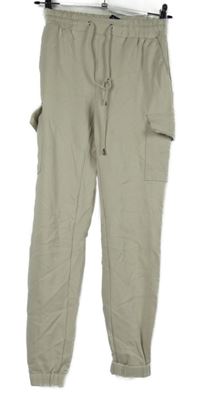 Dámske béžové cargo tepláky s vreckami Amisu vel. 32