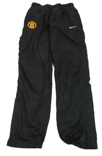 Černé šusťákové fotbalové podšité kalhoty - Manchester United Nike