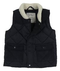 Tmavomodrá šusťákovo/manšestrová zateplená vesta Matalan