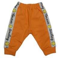 Neónově oranžovo-sivé tepláky s nápismi a smajlíkmi