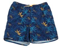 Tmavomodro-oranžové plážové kraťasy s listy Olaian 