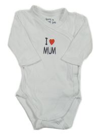 Bílé body s nápisem Tchibo