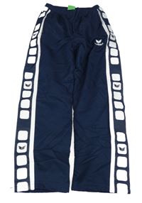 Tmavomodro-bílé šusťákové podšité kalhoty s logy Erima