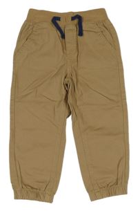 Béžové plátenné cuff nohavice