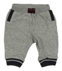 Sivé melírované tepláky s tmavomodrým lemem