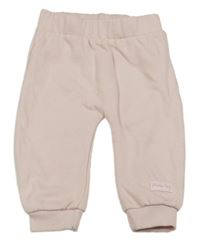 Světlerůžové tepláky s nápisem Dopodopo