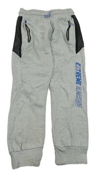 Šedé melírované tepláky nápisem Y.F.K.