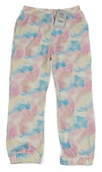 Nové - Bílo-barevné vzorované tepláky Tu