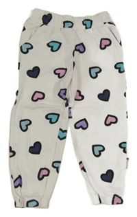 Bílé tepláky se srdíčky Sinsay