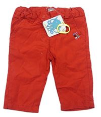 Červené plátenné nohavice s výšivkou