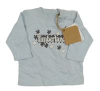 Nové - svetlomodré tričko s puzzlíky a logom Timberland