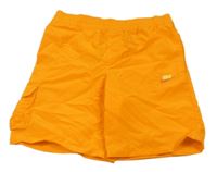 Neónově oranžové plážové kraťasy s logom Nike