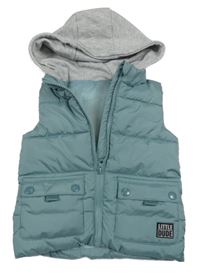 Světlemodrá šusťáková zateplená vesta s kapucí Dunnes