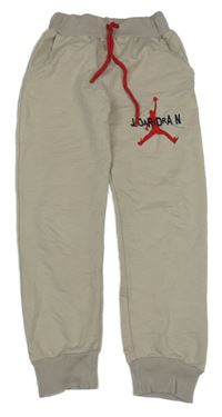 Béžové cuff tepláky s logem Nike Jordan 